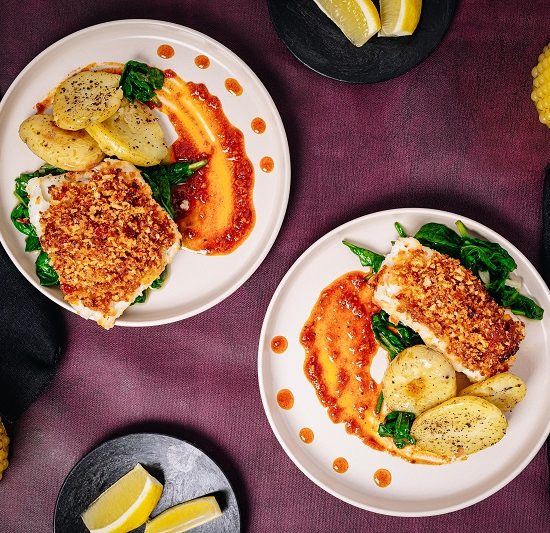 Spicy Red Pepper Pesto Crusted Haddock with Crushed New Potatoes and Spinach